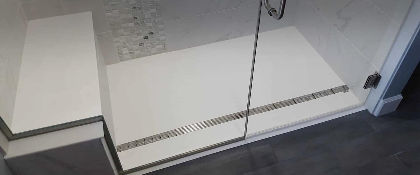 Close-up of integrated linear drain system with precision engineering